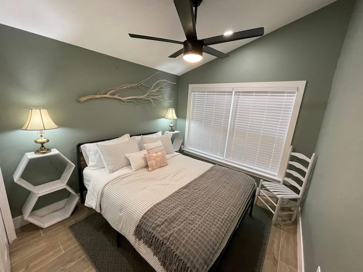 The bedroom is serene and cozy!