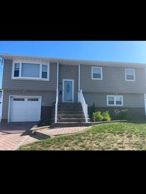 Cheerful 4 bedroom home with parking on premises.