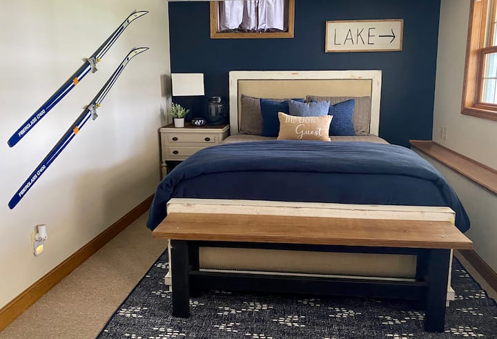 Bedroom 1 - on walk-out basement level, lake view and private entrance to outdoor patio