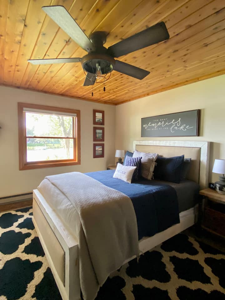 Bedroom 2 - on walk-out basement level, lake view and private entrance to outdoor patio