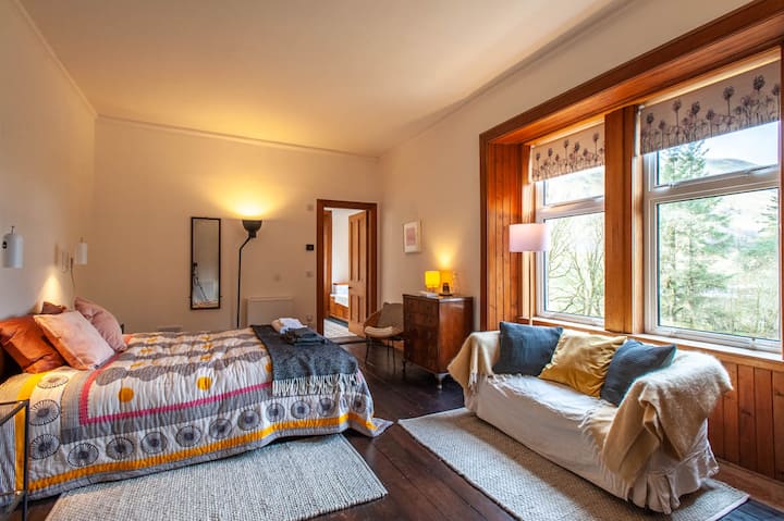 Views over to the hills from the bedroom and over the river from the en-suite bathroom.