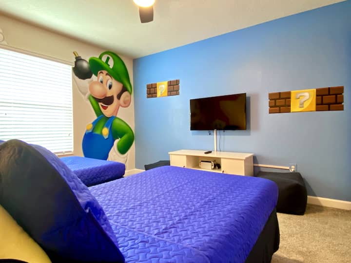 This room has a Nintendo Switch OLED for you to play the newest games. Please feel free to log in to your account for access to your own games and game shop.