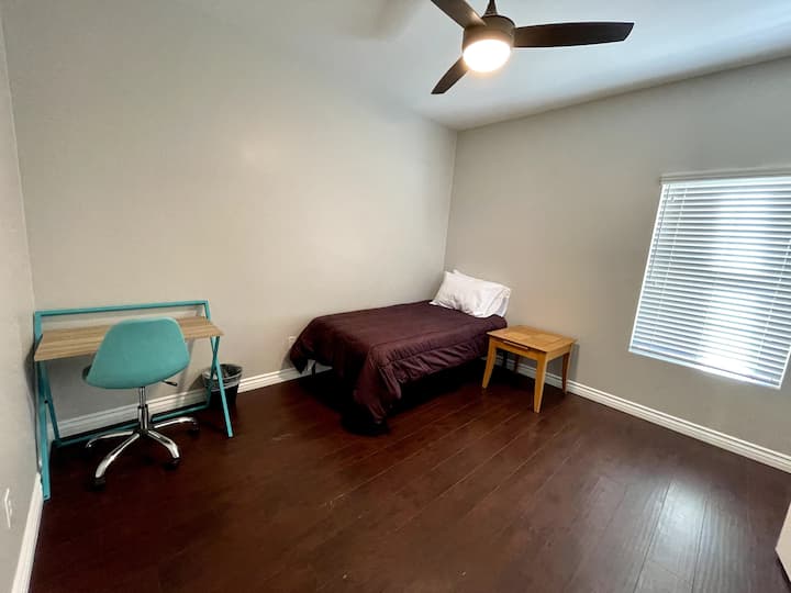 fifth bedroom  with twin bed and desk 