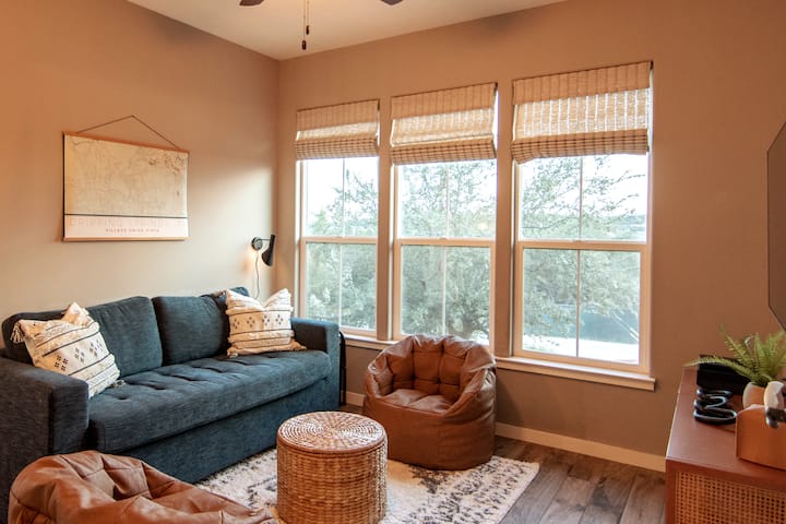 The flex room offers one queen sofa bed, separate courtyard access, a gaming console, and 55" Roku-equipped TV. It has access to a powder room and a shared full bathroom with shower/tub combo.