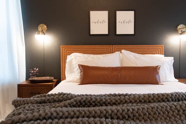 Master bedroom has one queen bed, a walk-in closet, and separate courtyard access.