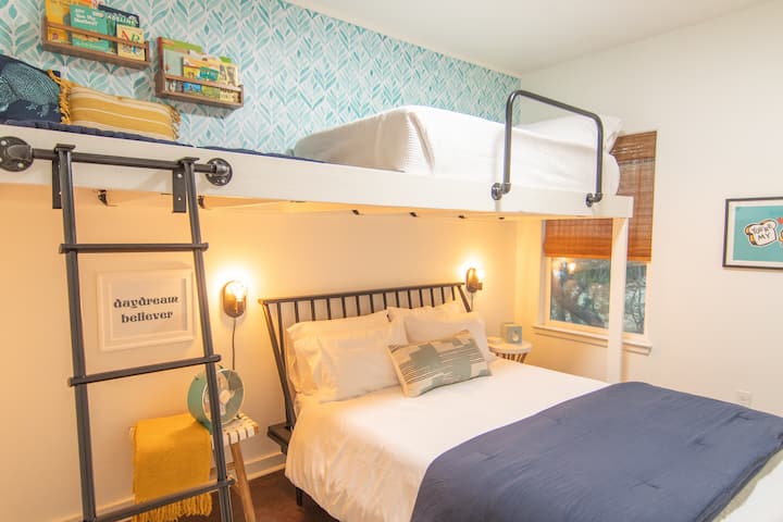 This bedroom boasts one queen bed, plus a loft with one twin bed and a reading nook, and a walk-in closet. It has access to a shared full bathroom with shower/tub combo.