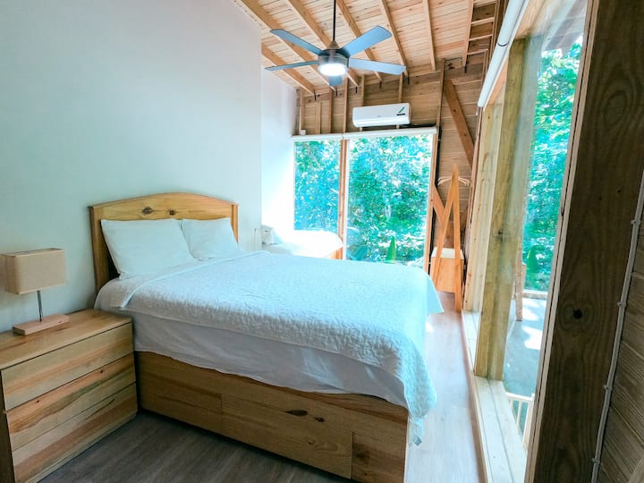 Bedroom #2 with a queen size bed and a twin bed. Day view