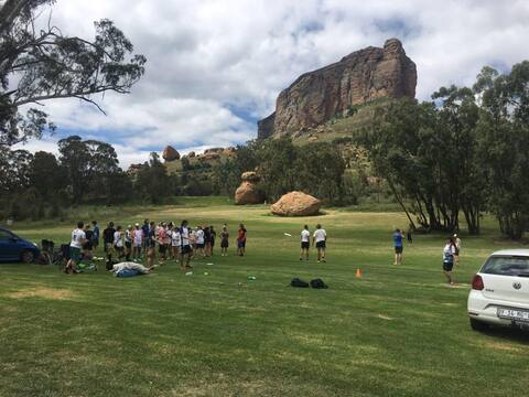 Sandstone farm house at foot of a unique mountain