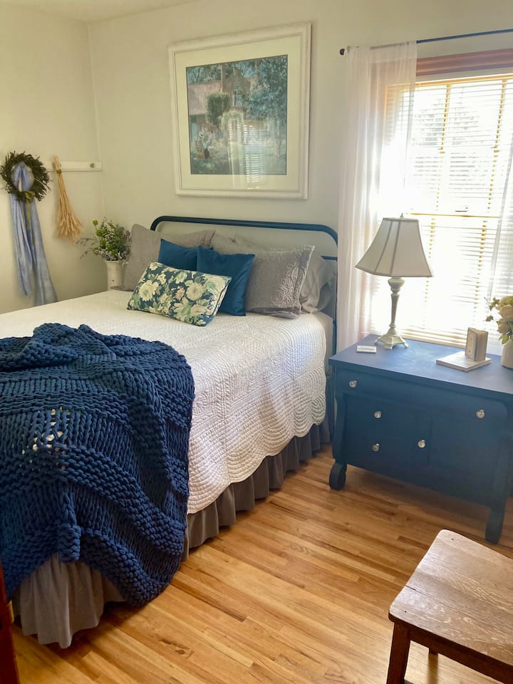 main floor guest room, farm views out both windows,  large step in closet, full length mirror