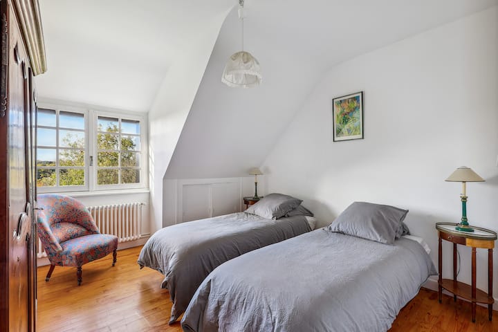 One of the three bedrooms with two single beds.