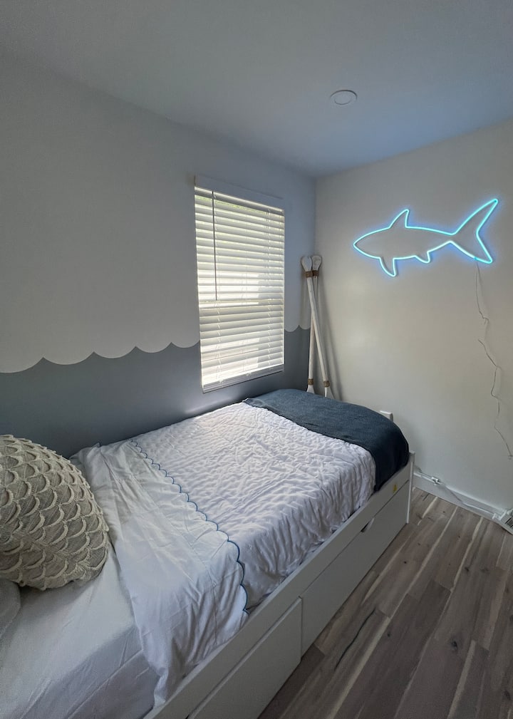 kids bedroom with two twins and a trundle