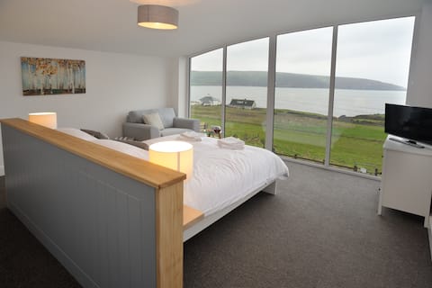 Stunning 14 sleeper holiday home with sea views.