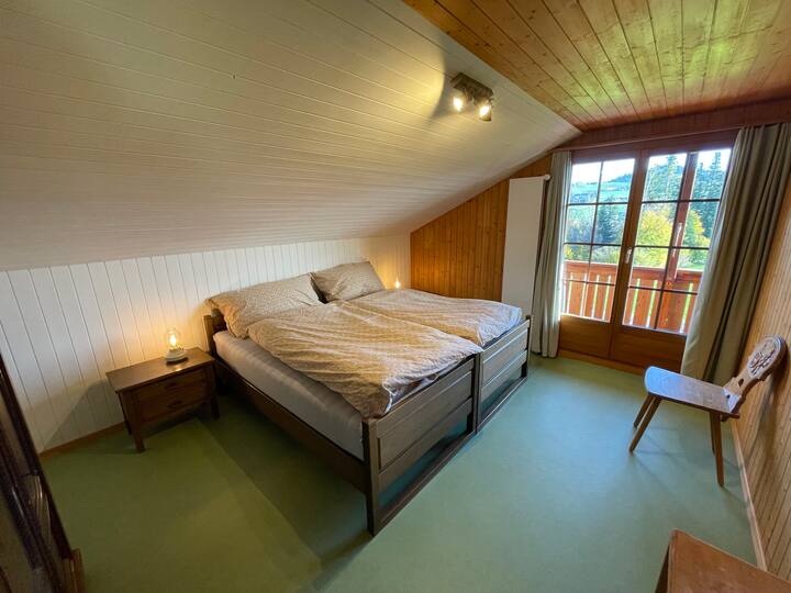 the spacious bedroom includes a double bed (190 cm long * 190 cm wide) with a closet and access to the terrace with wonderful views