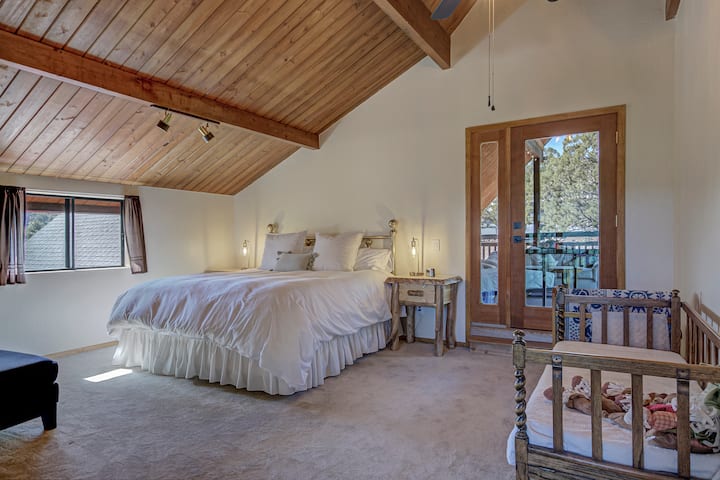 Primary loft bedroom with king bed, ensuite full bath, and it even has its own private covered deck.