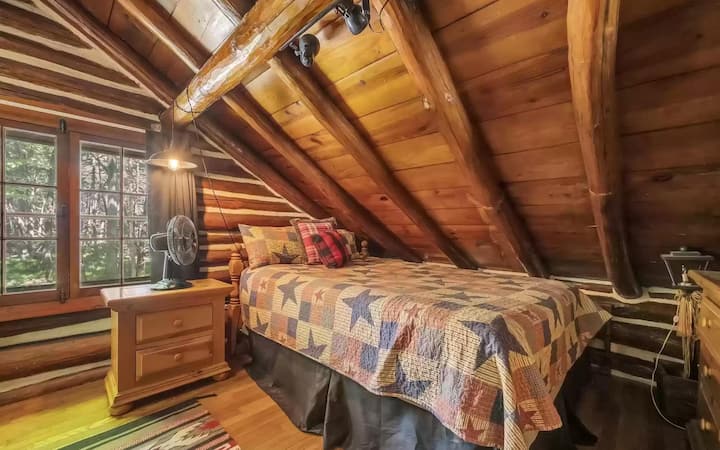 A queen bed is available in one of the two bedrooms on the second floor.