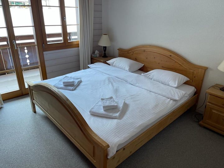 Bedroom 2 with queen size double bed with direct access to south facing balcony and en-suite shower/sink/loo.