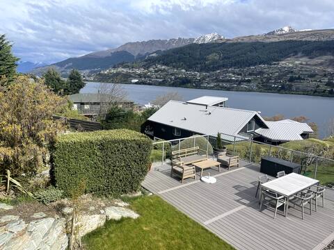 Modern apartment overlooking lake and mountains