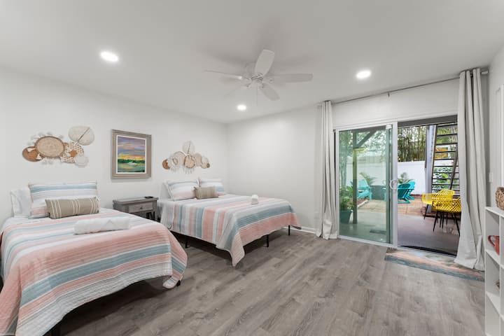 Large Queen/Twin bedroom downstairs leads to  patio/fenced backyard.