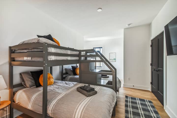 This bedroom is equipped with (3) twin for an excellent nights sleep. Each a high quality, Serta mattress. Relax and read in the sitting nook or watch your favorite download show! Happiness Hideaway has it all! Enjoy