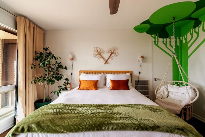 Snuggle up in this tree swing with a soft blanket and read a book with the same breathtaking view! This room also has a fold away crib so families have an option both downstairs and upstairs!