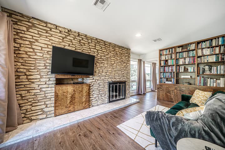 This bonus room has blackout curtains and doors that connect to the master and twin room. It can be used for sleeping as the sofa folds down into a full bed, or as a secondary living room for upstairs guests.