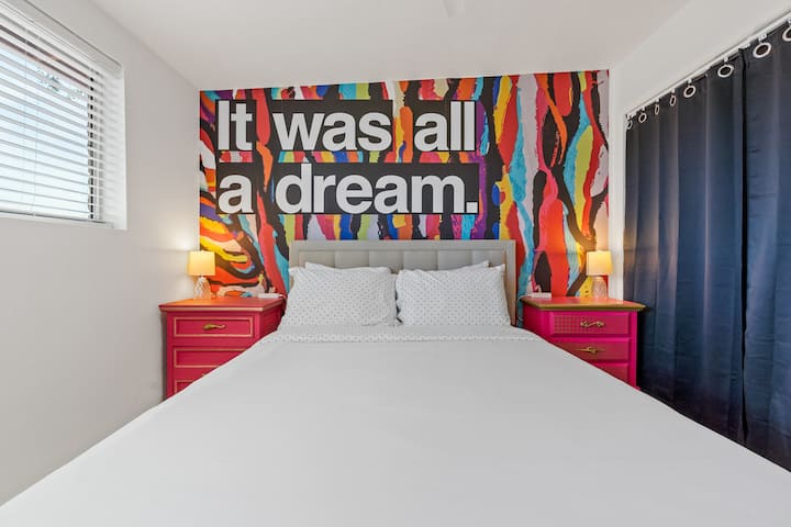 Secondary bedroom has a memory foam queen size mattress, hand painted antique furniture, a really fun mural, and closet with storage and extra bedding.