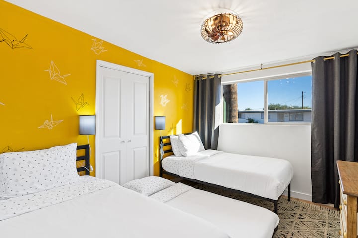 2 memory foam twin size mattresses, plus a 3rd twin trundle bed. This room sleeps a total of 3 people. Hand painted furniture is carried into this room as well as easy access to USB ports for charging devices.