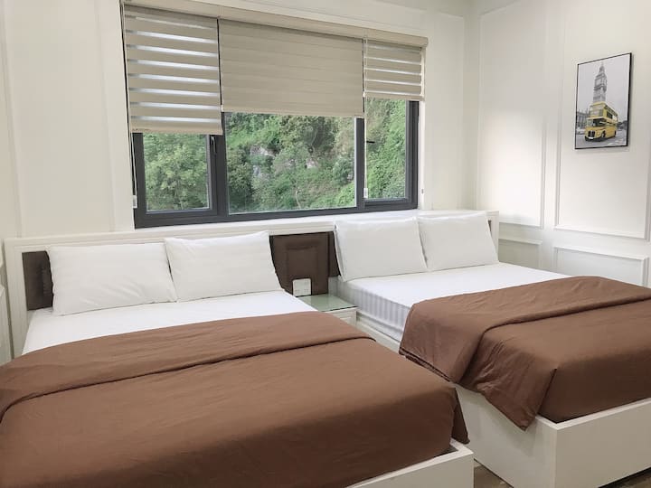 The family room with 2 double beds , moutain view