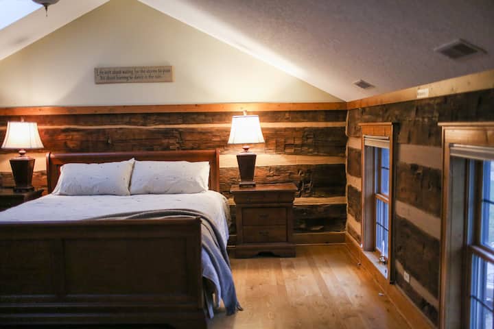 Upstairs main bedroom with king bed and en suite bathroom.