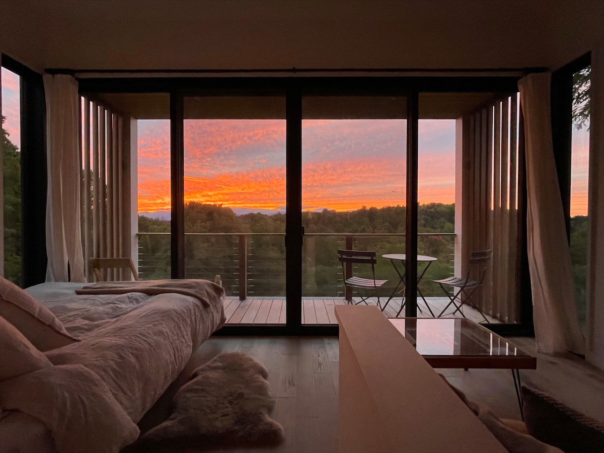 View from bed at the Tiny House as the sun sets. 