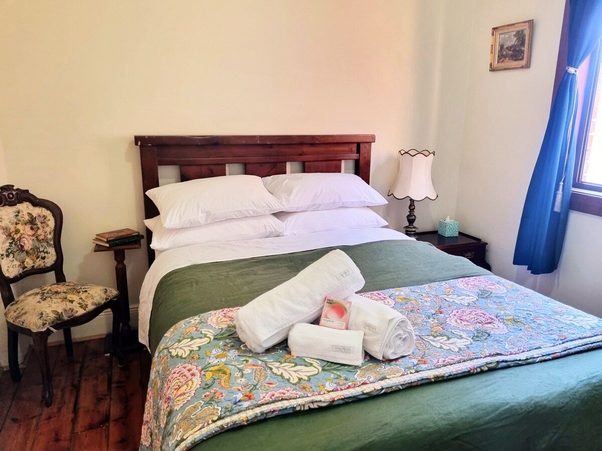 Second bedroom with queen-sized bed tucked away in the quiet rear of the apartment.