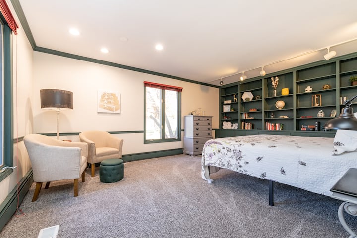 First floor bedroom with King size bed, library and reading nook.