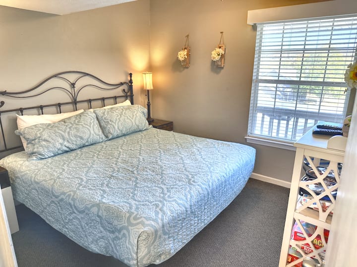 Main floor bedroom is equipped with a comfortable king bed and clean linens. 