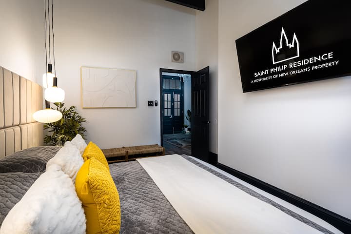 Primary bedroom with 55" Smart TV and hotel grade linens. 