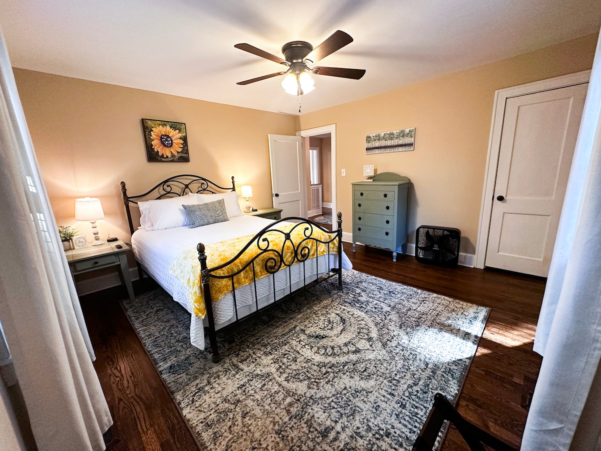 One of two bedrooms on first floor with box and ceiling fans, 40" SMART TV and large closet. Between the two bedrooms is a full bath.