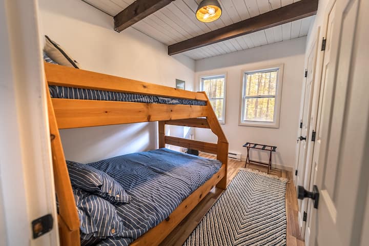 Bunk beds with a full mattress on the bottom and a twin on top.





Photo Credit @dirtandglass