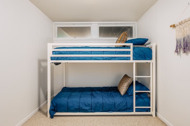 Bunk room in basement with new mattresses