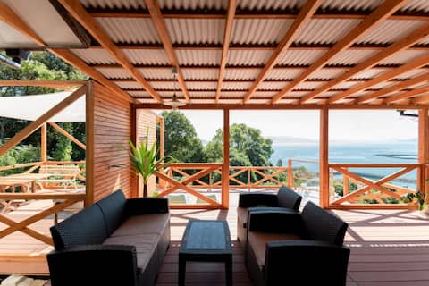 This cottage has a spacious deck overlooking the Amakusa sea [VIVA SUMOTO]