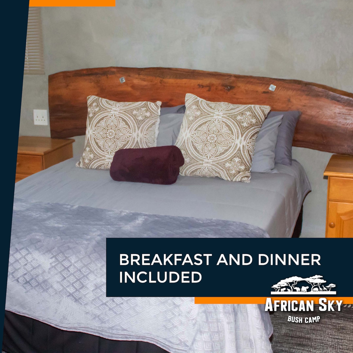 A cozy sleeping area is showcased, featuring a spacious bed with a light grey blanket and decorative pillows. Natural wood accents form the headboard, while bedside tables are positioned on either side. Soft lighting enhances the serene atmosphere of the room.