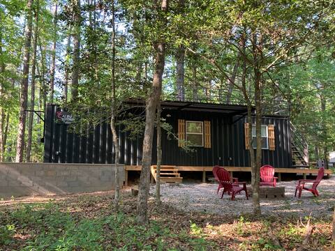 Cozy shipping container nestled in the forest!