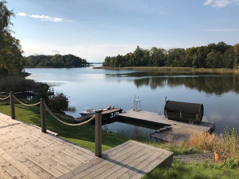 Lake location with rowing boat, sauna and large outdoor deck.
