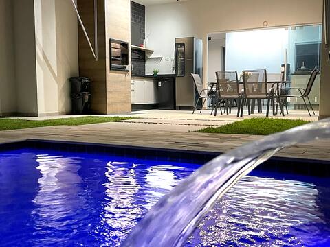 Modern country house with pool and barbecue grill.