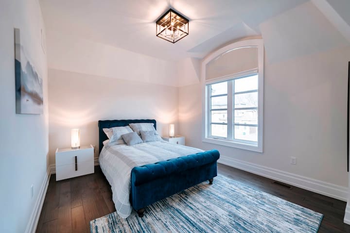The third bedroom features blue accents for a cozy feel