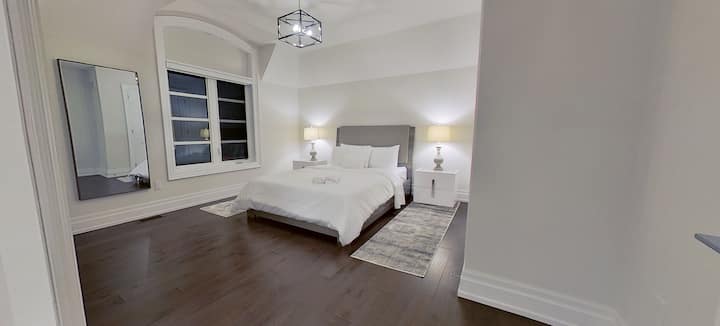 The second bedroom accentuates a modern grey theme