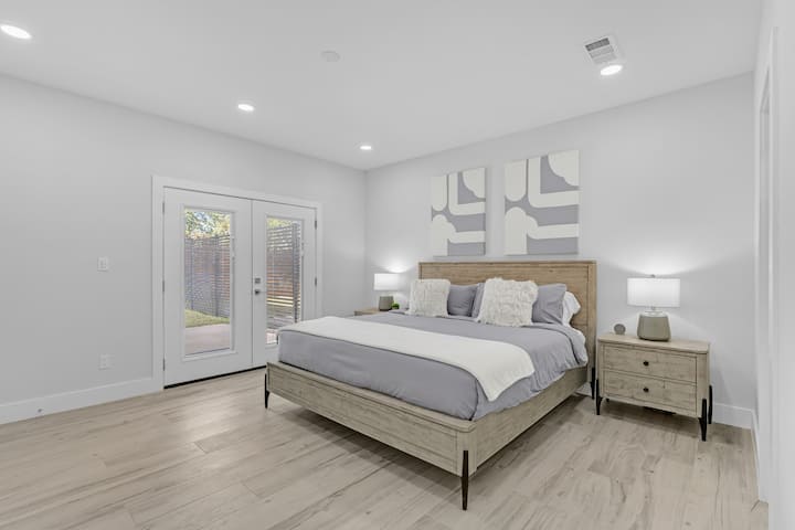 1st floor bedroom opens up to the private  backyard and patio