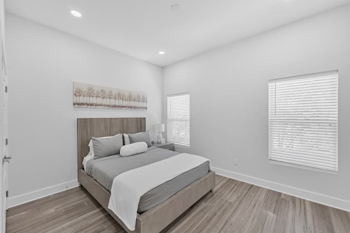 2nd floor bedroom located next to kitchen with Queen bed