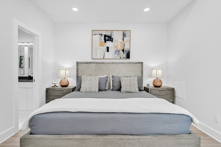 Master bedroom with luxe King bed, en suite bathroom and closet