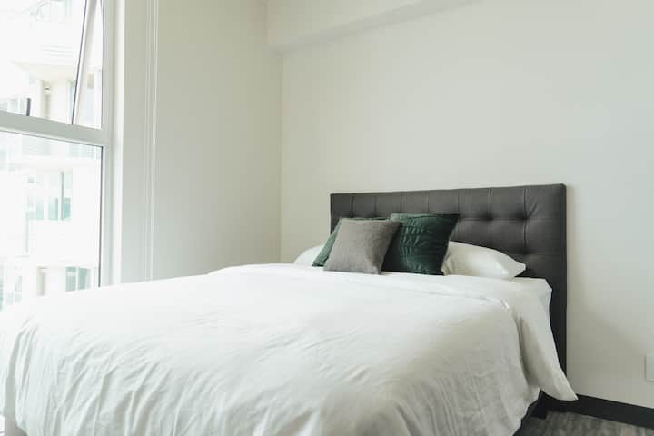 Queen size bed, premium lining for sleeping comfort. Portable air cooler in bedroom. 