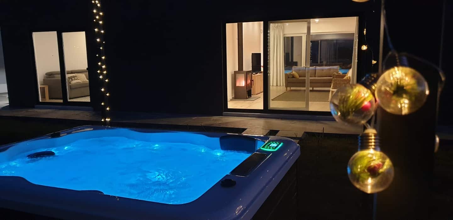 Villa pool surrounded by tropical plants