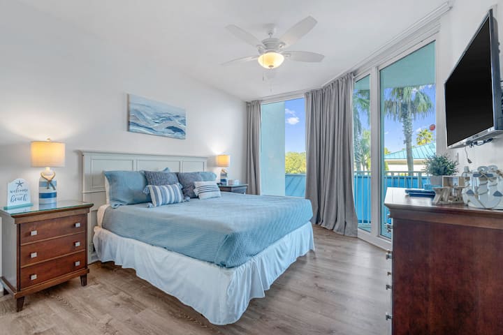 Large Second Guest Bedroom,  private balcony access overlooking the Lagoon Pool and Tropical Garden.  